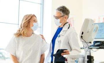 Doctor and patient wearing masks